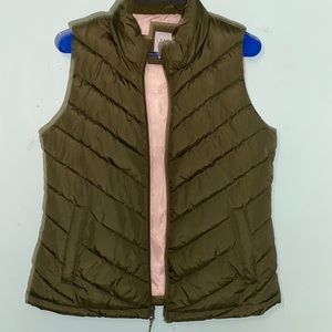 Green and pink puffer gap vest.